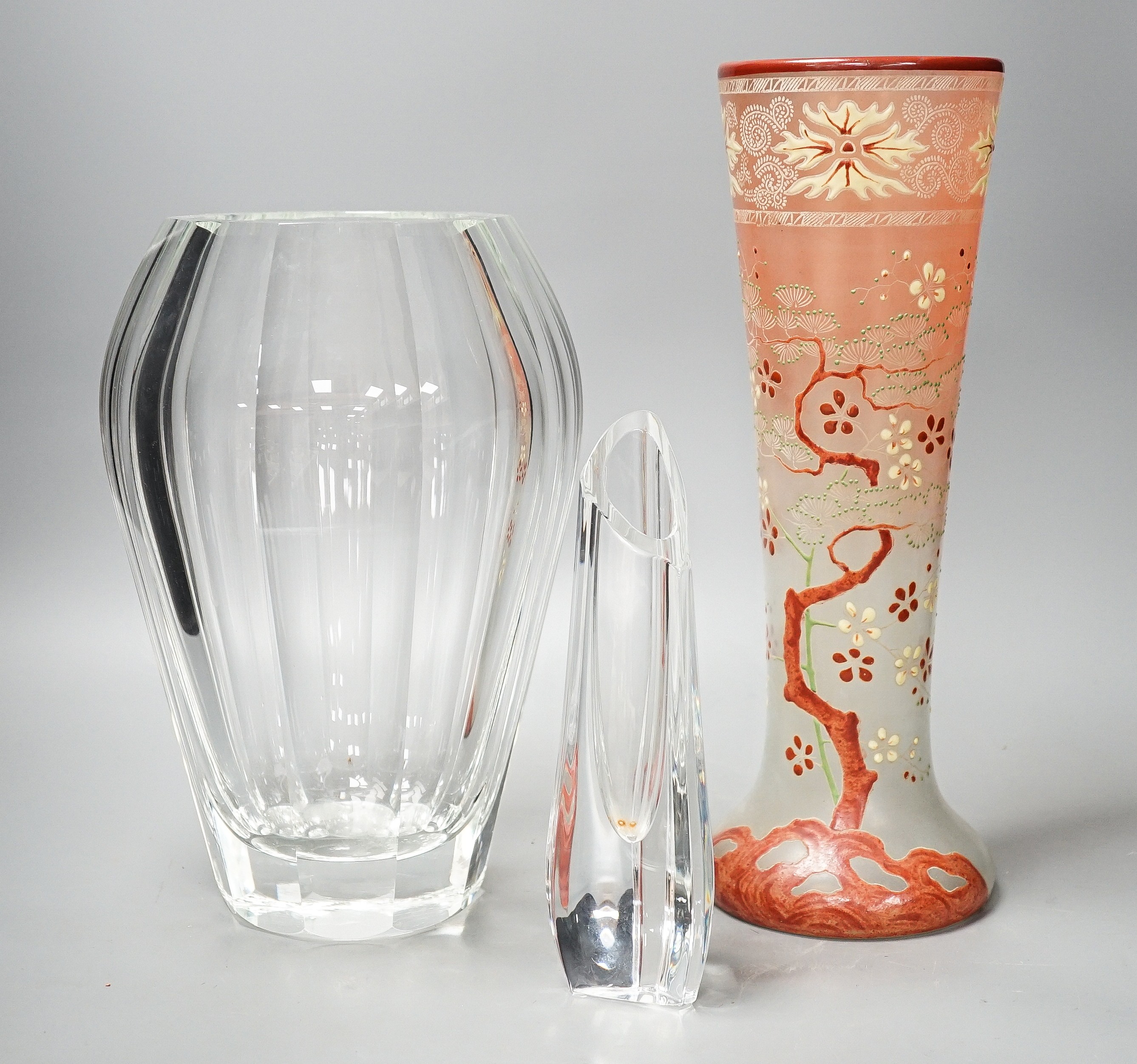 A tall Bohemian enamelled glass vase, 35cm, manner of Moser, a Moser heavy facet cut glass vase, 29.5cm, etched mark, and a Baccarat moulded glass vase (3)